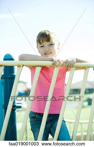 Child on playground equipment View Large Photo Image Stock Image - Child on playground equipment. Fotosearch