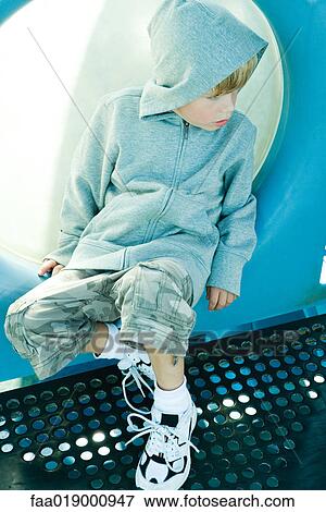 Stock Photo - Child on playground equipment. Fotosearch