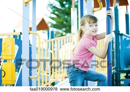 Child on playground equipment View Large Photo Image Stock Photo - Child on playground equipment. Fotosearch