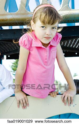 Stock Photo - Child on playground equipment. Fotosearch