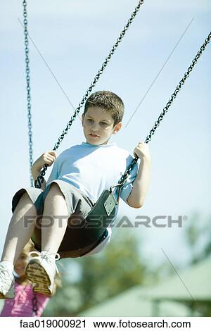 Child on swing View Large Photo Image Stock Image - Child on swing. Fotosearch