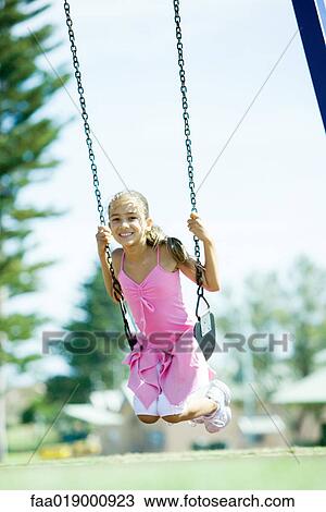 Child on swing View Large Photo Image Stock Image - Child on swing. Fotosearch
