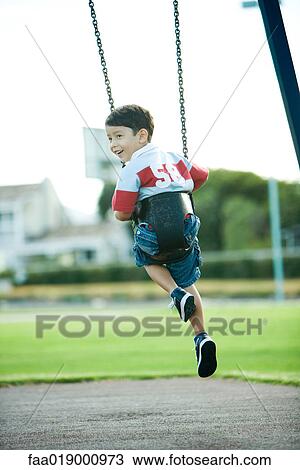 Child on swing View Large Photo Image Stock Image - Child on swing. Fotosearch