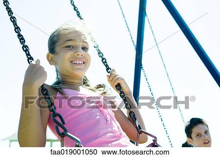 Child on swing View Large Photo Image Stock Image - Child on swing. Fotosearch