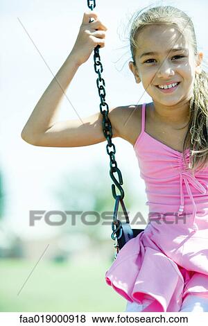 Child on swing View Large Photo Image Stock Photo - Child on swing. Fotosearch