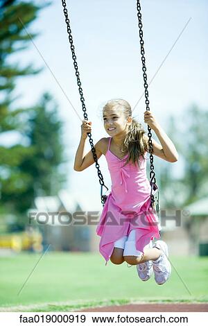 Child on swing View Large Photo Image Stock Photo - Child on swing. Fotosearch