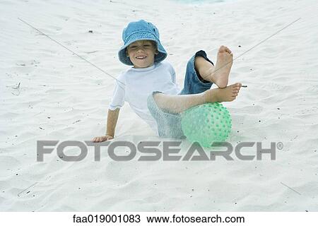 Child playing in sand View Large Photo Image Stock Image - Child playing in sand. Fotosearch