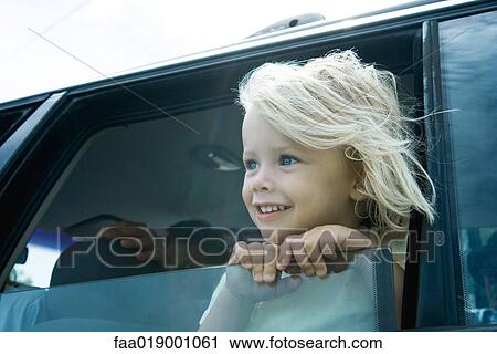 Child sticking head out of car window View Large Photo Image Stock Image - Child sticking head out of car window. Fotosearch