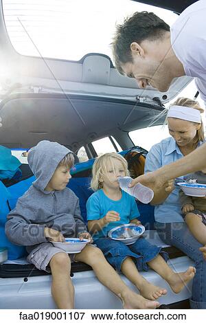 Children eating meal in back of car View Large Photo Image Stock Photo - Children eating meal in back of car. Fotosearch
