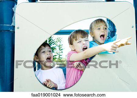 Picture - Children on playground equipment. Fotosearch