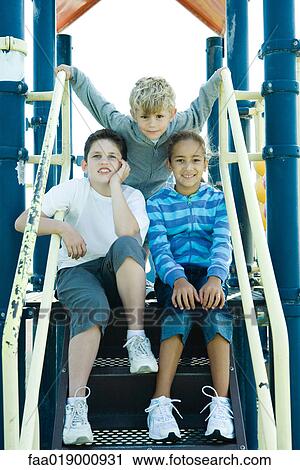 Stock Image - Children on playground equipment. Fotosearch