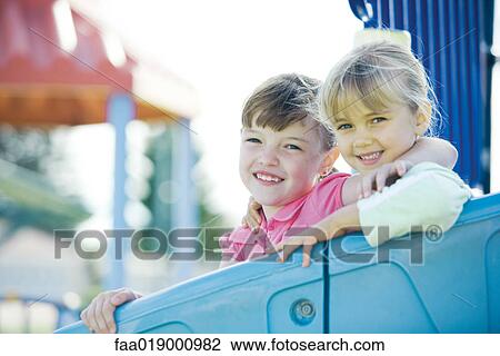 Stock Image - Children on playground equipment. Fotosearch