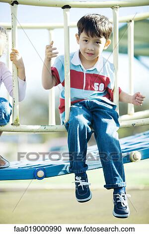 Children on playground equipment View Large Photo Image Stock Image - Children on playground equipment. Fotosearch