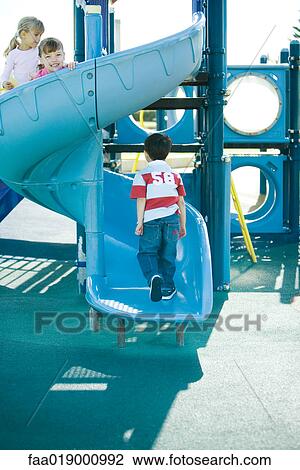 Children on playground equipment View Large Photo Image Stock Image - Children on playground equipment. Fotosearch