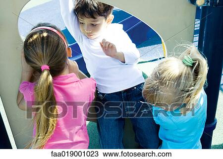 Children on playground equipment View Large Photo Image Stock Image - Children on playground equipment. Fotosearch
