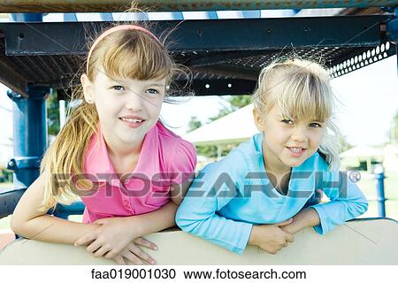 Children on playground equipment View Large Photo Image Stock Image - Children on playground equipment. Fotosearch