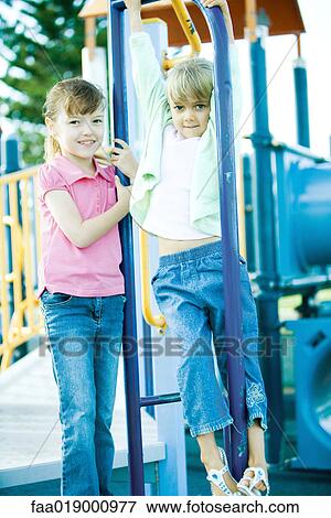 Children on playground equipment View Large Photo Image Stock Photo - Children on playground equipment. Fotosearch