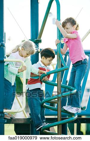 Stock Photo - Children on playground equipment. Fotosearch
