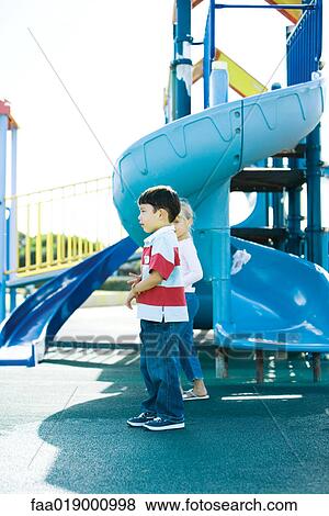 Stock Photo - Children on playground equipment. Fotosearch