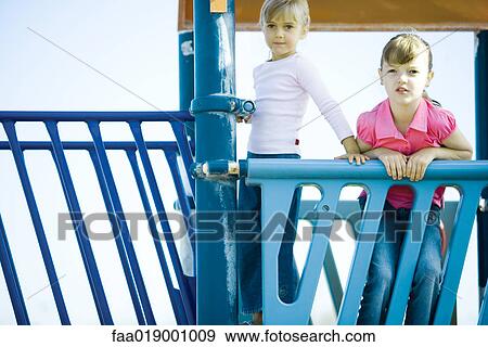 Stock Photo - Children on playground equipment. Fotosearch