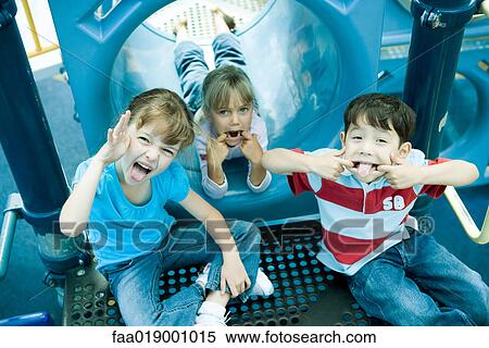 Children on playground equipment View Large Photo Image Stock Photography - Children on playground equipment. Fotosearch