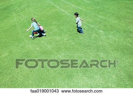 Children playing ball on grass View Large Photo Image Stock Image - Children playing ball on grass. Fotosearch