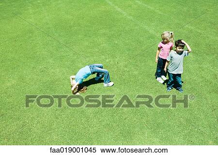 Children playing ball on grass View Large Photo Image Stock Photography - Children playing ball on grass. Fotosearch