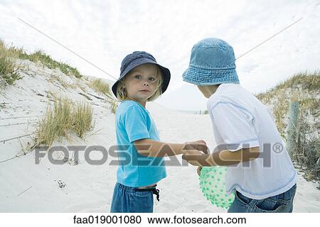 Children standing in dunes View Large Photo Image Stock Image - Children standing in dunes. Fotosearch