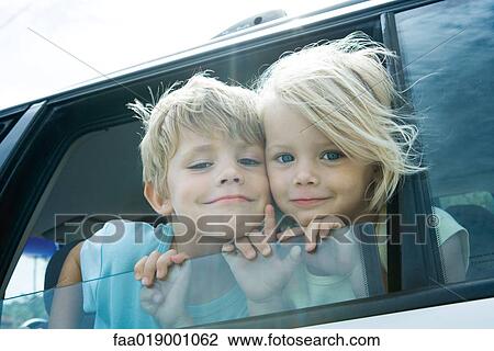 Children sticking heads out of car window View Large Photo Image Stock Image - Children sticking heads out of car window. Fotosearch