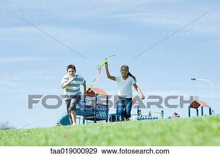 Stock Photo - Children with kite. Fotosearch