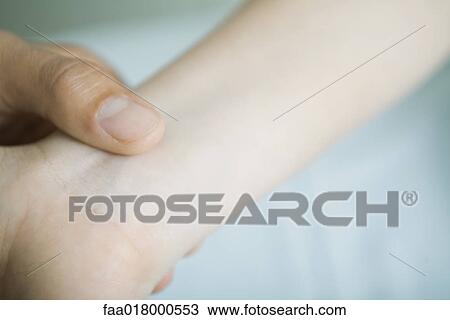 Doctor taking woman's pulse, close-up View Large Photo Image Stock Image - Doctor taking woman's pulse, close-up. Fotosearch