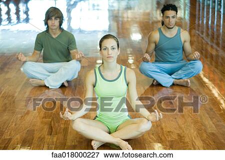Exercise class sitting in lotus position View Large Photo Image Stock Photo - Exercise class sitting in lotus position. Fotosearch