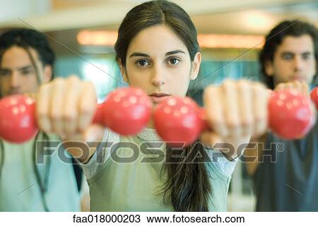 Exercise class working out with dumbbells View Large Photo Image Stock Image - Exercise class working out with dumbbells. Fotosearch