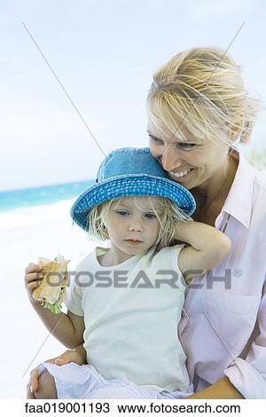 Family having picnic on beach View Large Photo Image Stock Image - Family having picnic on beach. Fotosearch