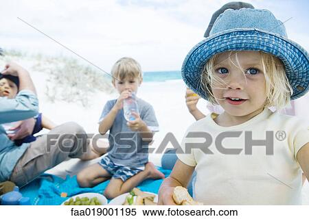 Family having picnic on beach View Large Photo Image Stock Photography - Family having picnic on beach. Fotosearch