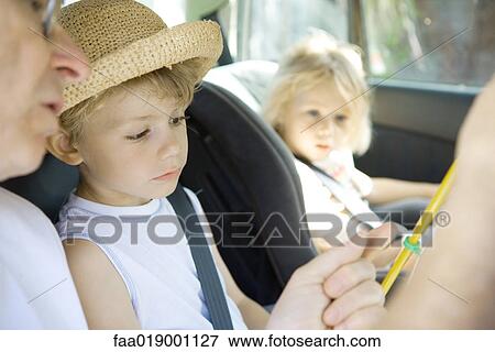 Family in car View Large Photo Image Stock Photo - Family in car. Fotosearch
