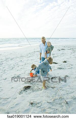 Picture - Family on beach. Fotosearch
