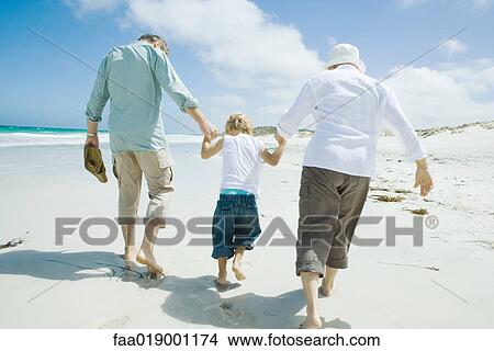Family on beach View Large Photo Image Picture - Family on beach. Fotosearch