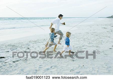 Family on beach, running View Large Photo Image Stock Image - Family on beach, running. Fotosearch