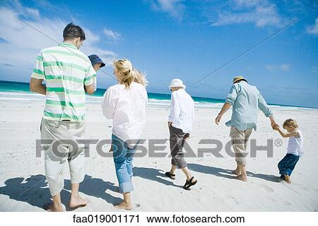 Stock Image - Family on beach. Fotosearch