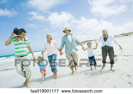 Stock Photo - Family on beach. Fotosearch