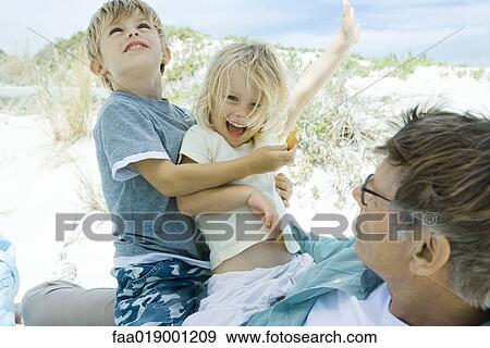Family on beach View Large Photo Image Stock Photo - Family on beach. Fotosearch