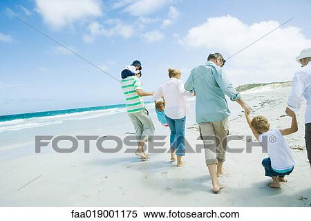 Stock Photography - Family on beach. Fotosearch