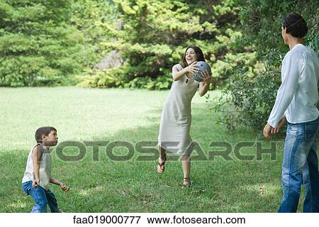 Family playing ball View Large Photo Image Stock Photo - Family playing ball. Fotosearch