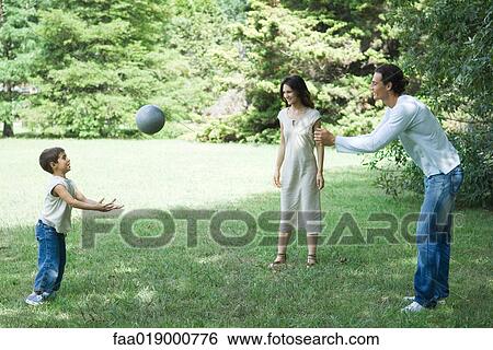 Family playing ball View Large Photo Image Stock Photograph - Family playing ball. Fotosearch