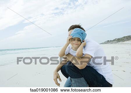 Father and child on beach View Large Photo Image Stock Photograph - Father and child on beach. Fotosearch