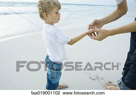 Father and son on beach View Large Photo Image Stock Image - Father and son on beach. Fotosearch