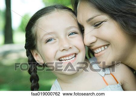 Girl and mother, laughing, close-up View Large Photo Image Stock Image - Girl and mother, laughing, close-up. Fotosearch