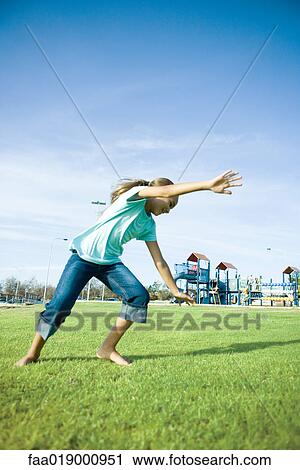 Girl doing cartwheel on grass View Large Photo Image Stock Image - Girl doing cartwheel on grass. Fotosearch