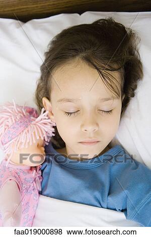 Stock Photo - Girl lying in hospital bed. Fotosearch